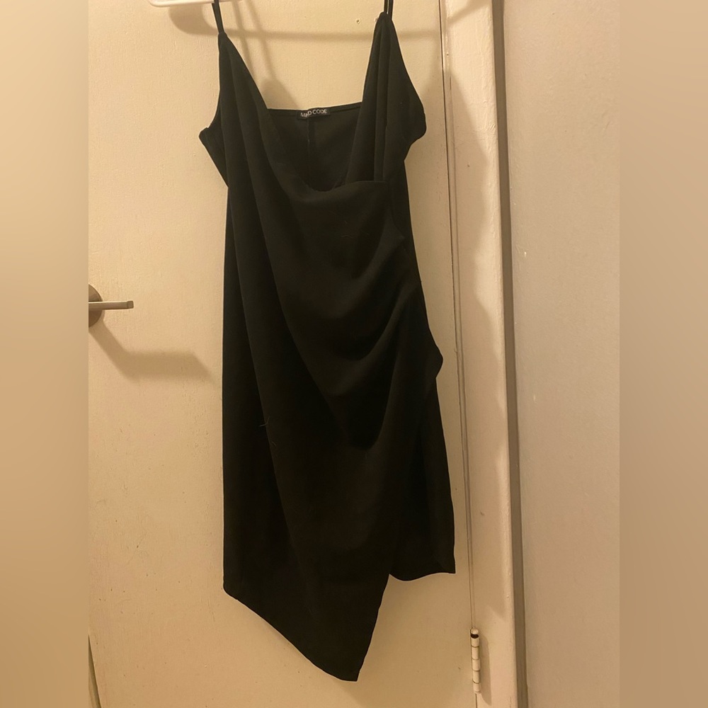 Black form fitting mini dress by Mind Code. Size XL